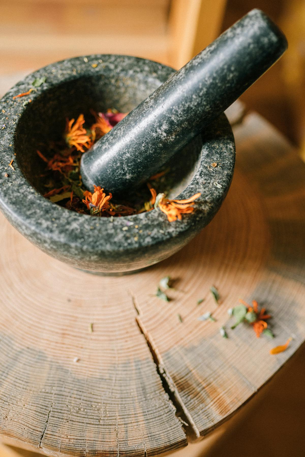 Traditional herbal medicine mortar with healing herbs